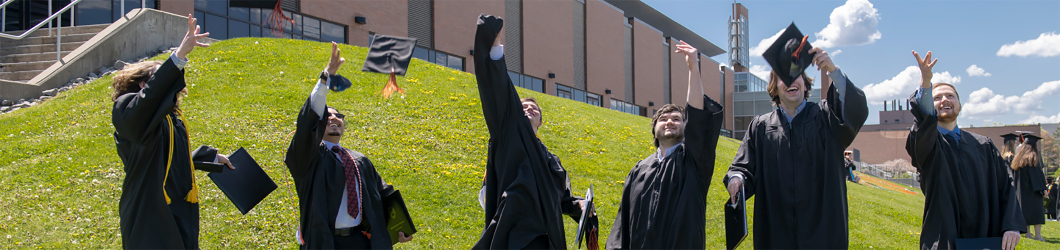 Students tossing their caps into the air.