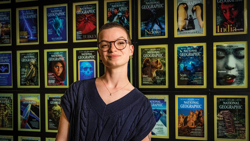 Anna Pasquantonio standing in front of wall of National Geographic magazine covers.
