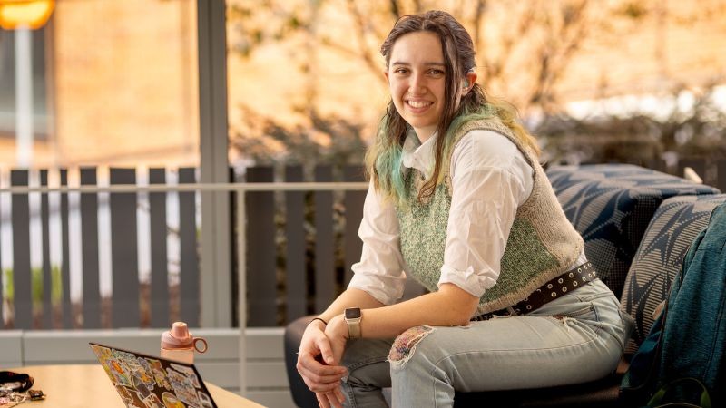 a photo of Julia outdoors on campus