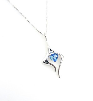 A sterling silver pendant with two tendrils on either side of a heart shaped blue gemstone.