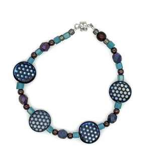 Bracelet made of a variety of glass and stone beads, with four large dot patterned beads.