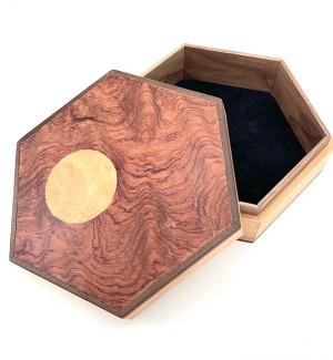 Hexagonal Lidded Wood Box with circle in a lighter wood on the lid.