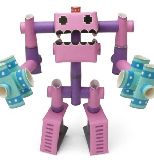 3D paper craft figure of a pink character wielding two hammers.