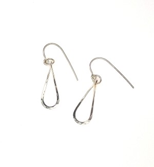 a handcrafted pair of Sterling silver tear drop shaped earrings with a subtle hammered surface.