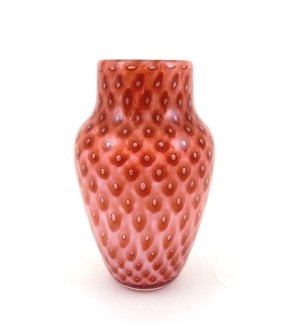 a handblown glass vase with a strawberry color tone highlighted with an optic stripe pattern.