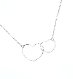 a Sterling silver pendant in the shape of two interlocking hearts on a silver chain.