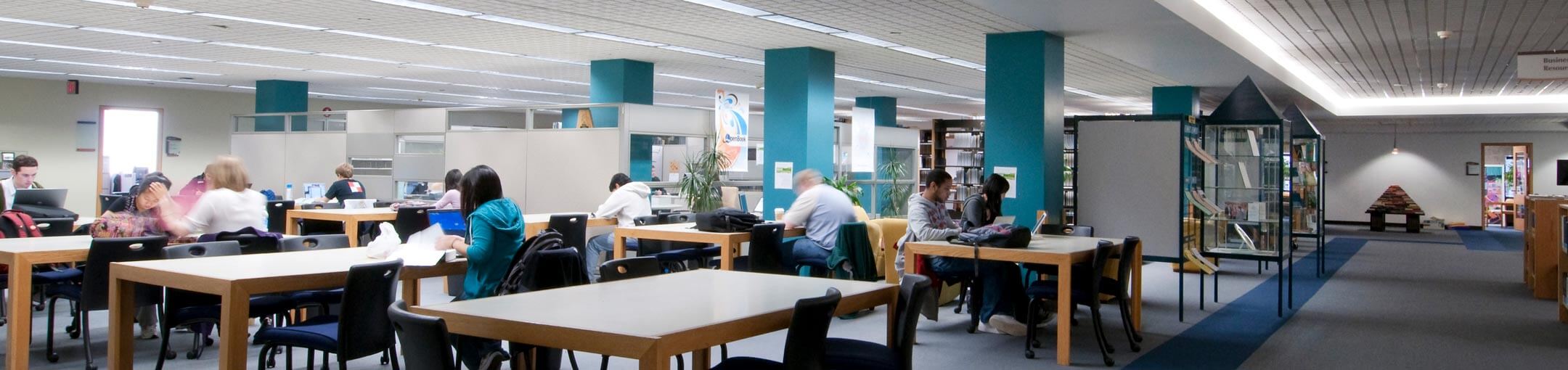 Students studying and working on projects in the library