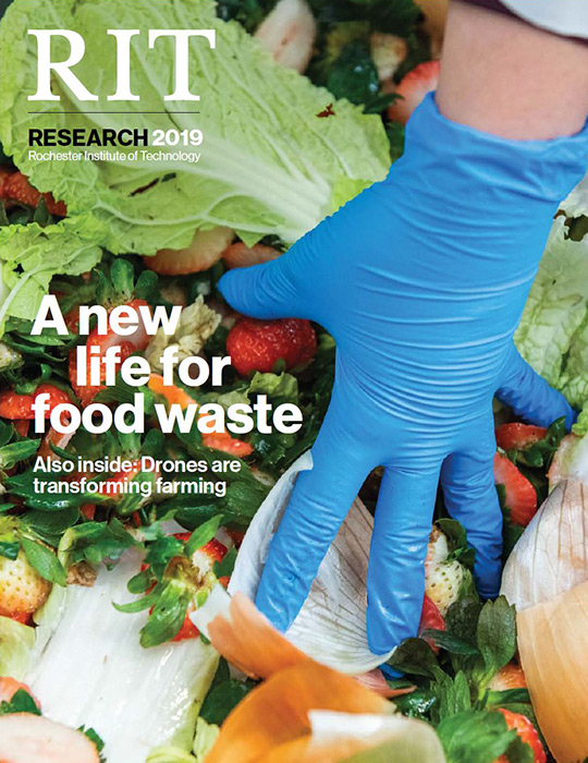 Magazine cover with photo of gloved hand grabbing food scraps.