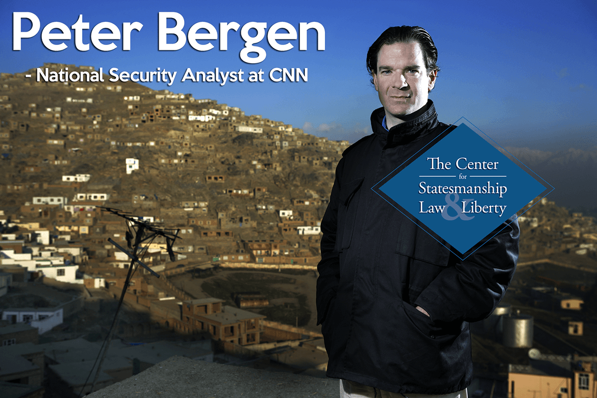 Peter Bergen, National Security Analyst at CNN, standing in the foreground with a town in the background.