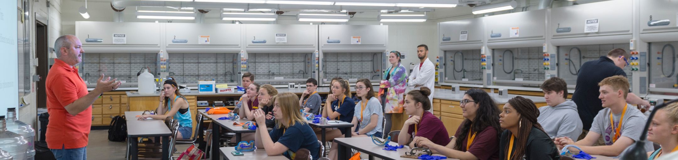 Students attending a lecture in a science lab