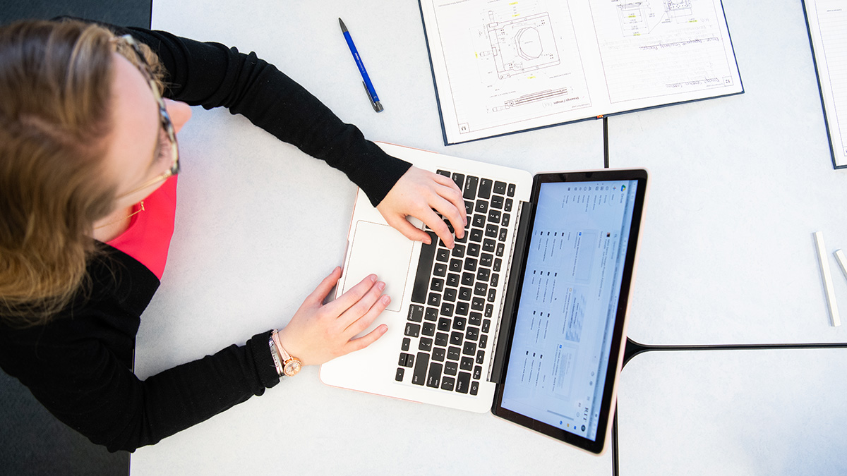 Overhead shot of person working on a laptop