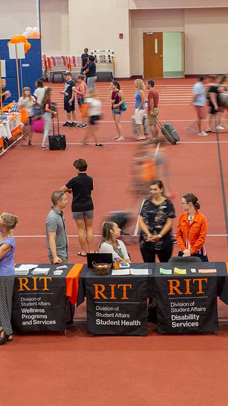 Students and families visiting tables at the Campus Resources Fair