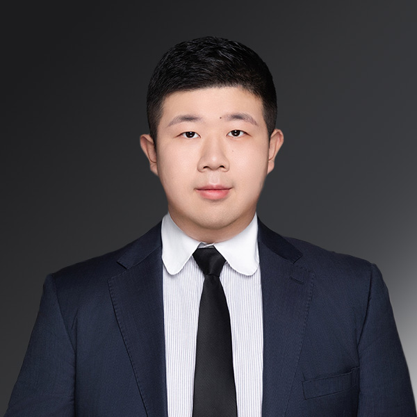 portrait of Ryan Zhang on a gray background