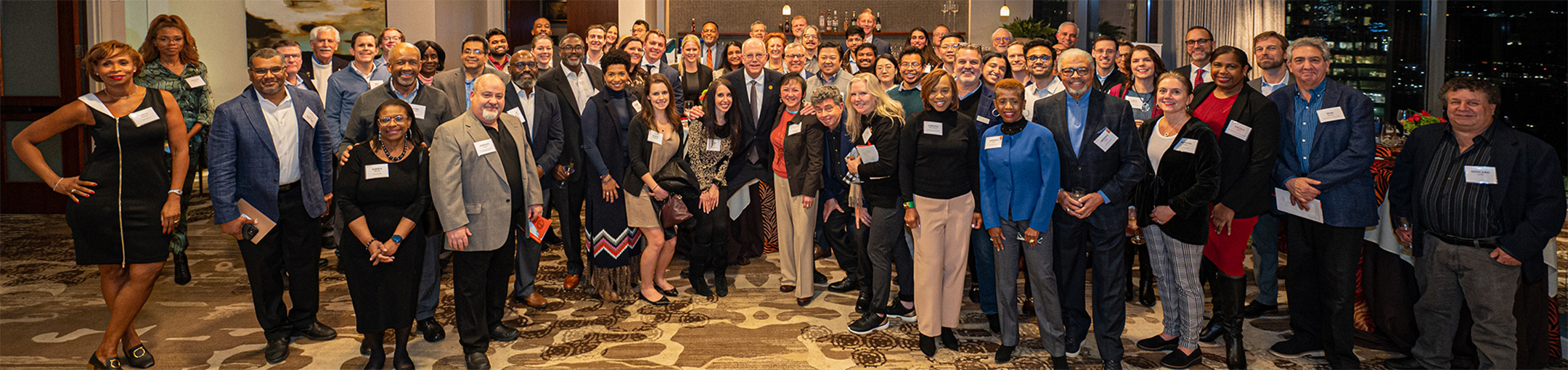 large group of alumni posing for a group photo.