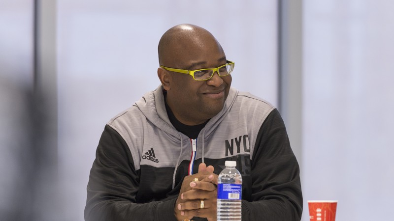 NBA event designer Gary Mack sits in a room, smiling as he chats with RIT students.
