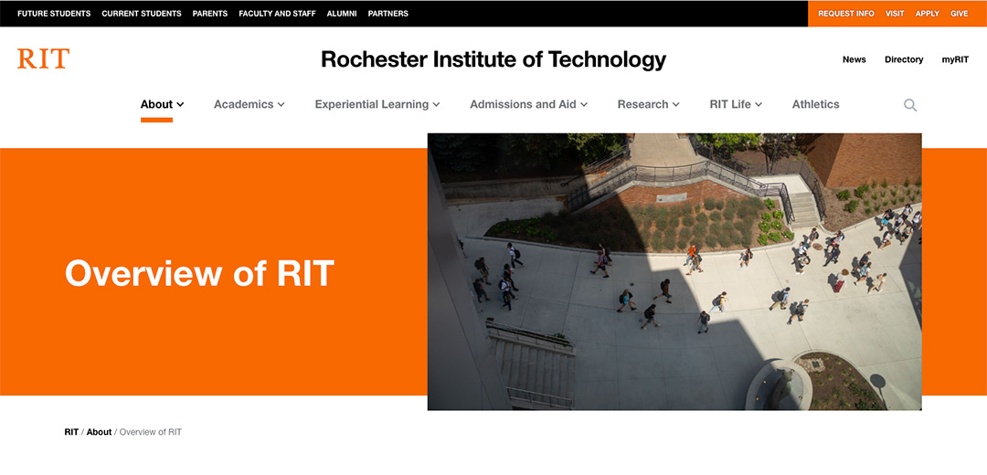 website banner showing people walking on campus.