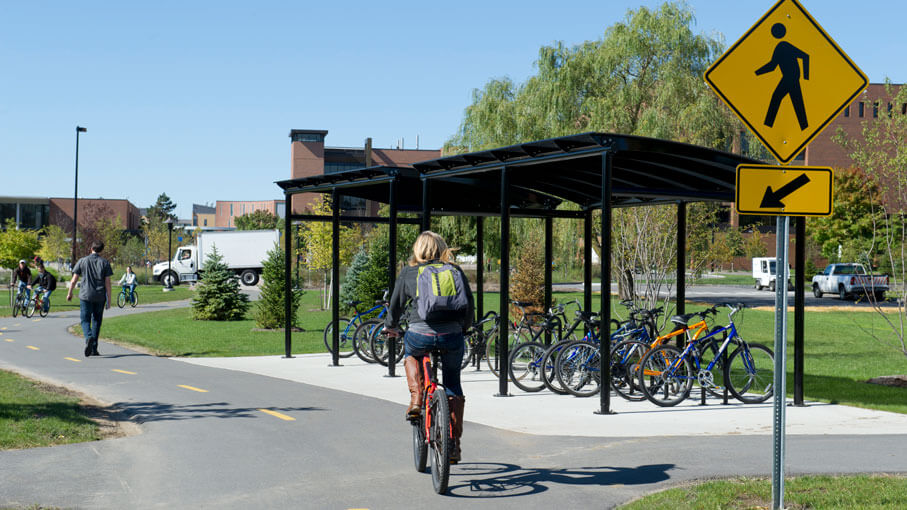 A person riding a bike on campus.