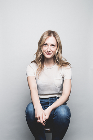 portrait of Melanie Shapiro sitting on stool