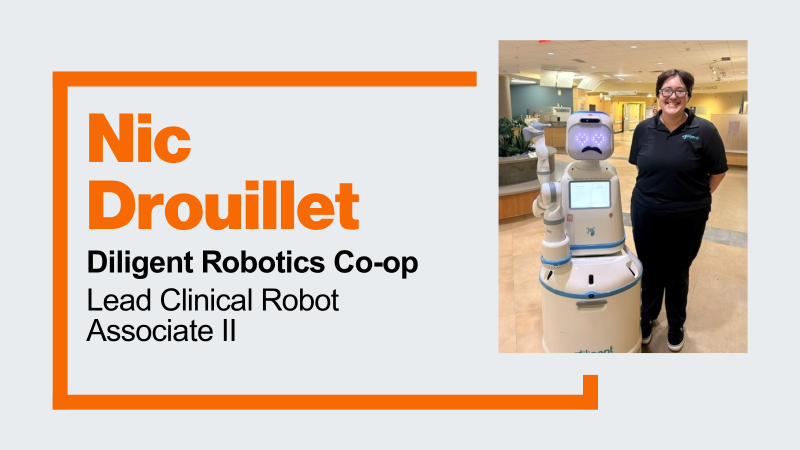 student Nic Drouillet standing beside Moxi, a robot assistant