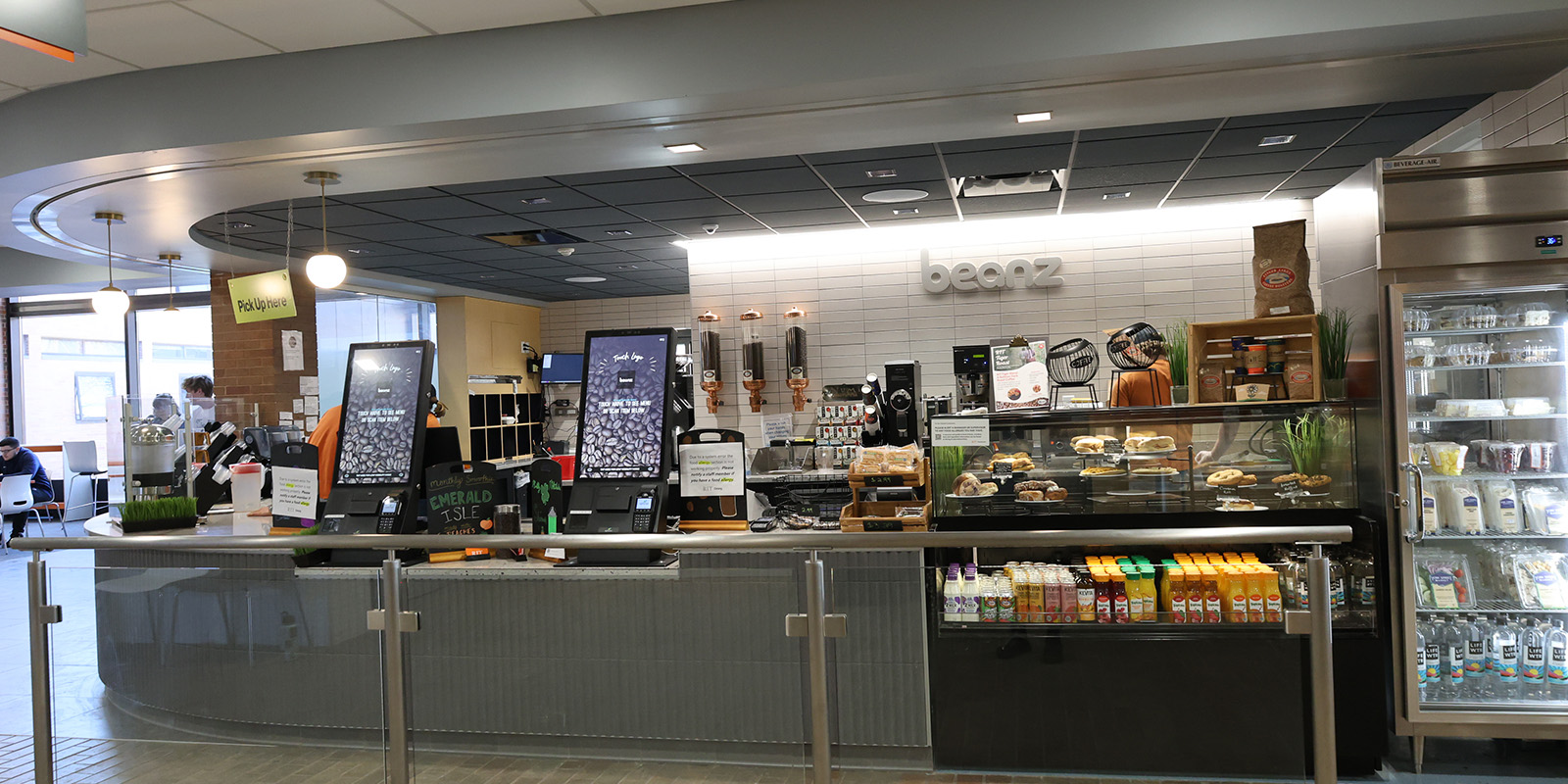 ﻿Beanz café with a sleek design, kiosks, pastries, and a stocked beverage fridge