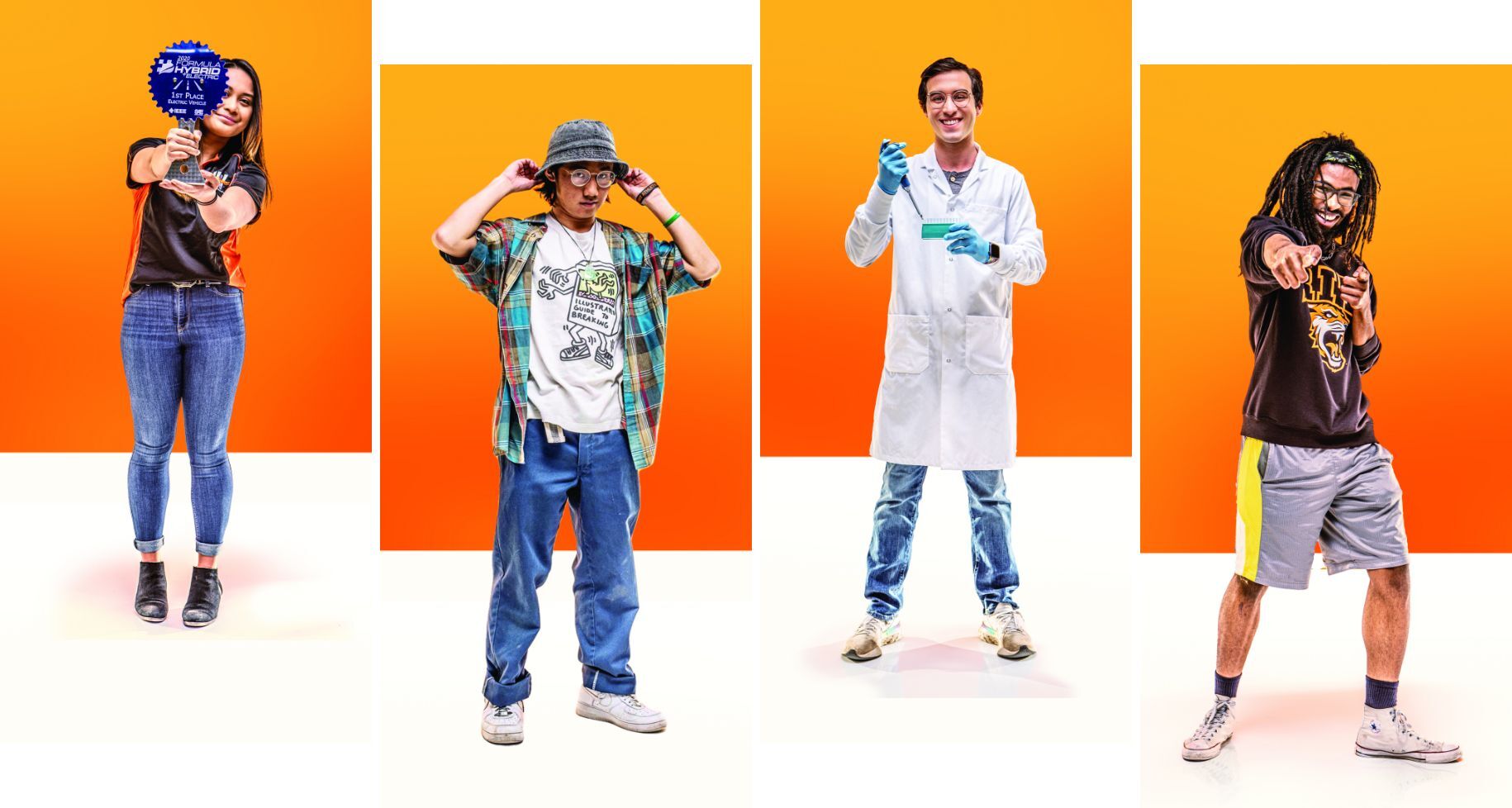 Four students standing in front of orange backgrounds posing