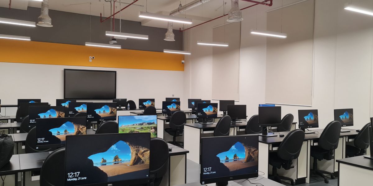 Computer lab with many windows desktop computers