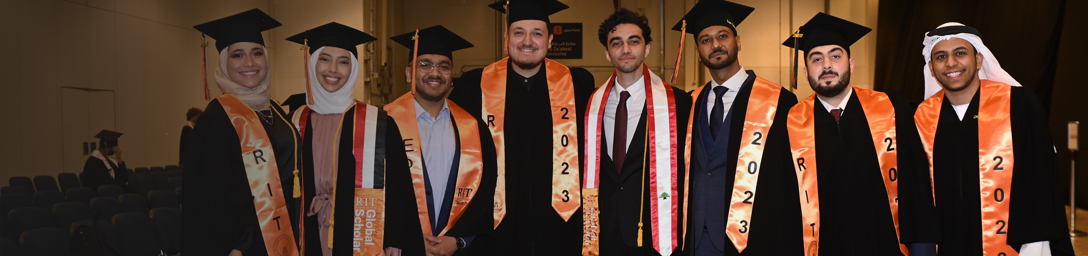 A group of RIT graduates posing for a picture
