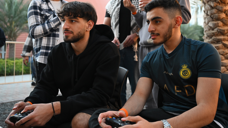 Two students playing playstation