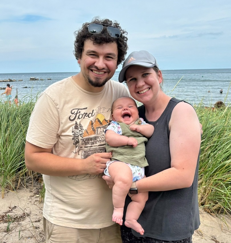 Potrait of Alicia (Wyble) Stenglein '18 (CLA) and her husband Zack with baby Harper