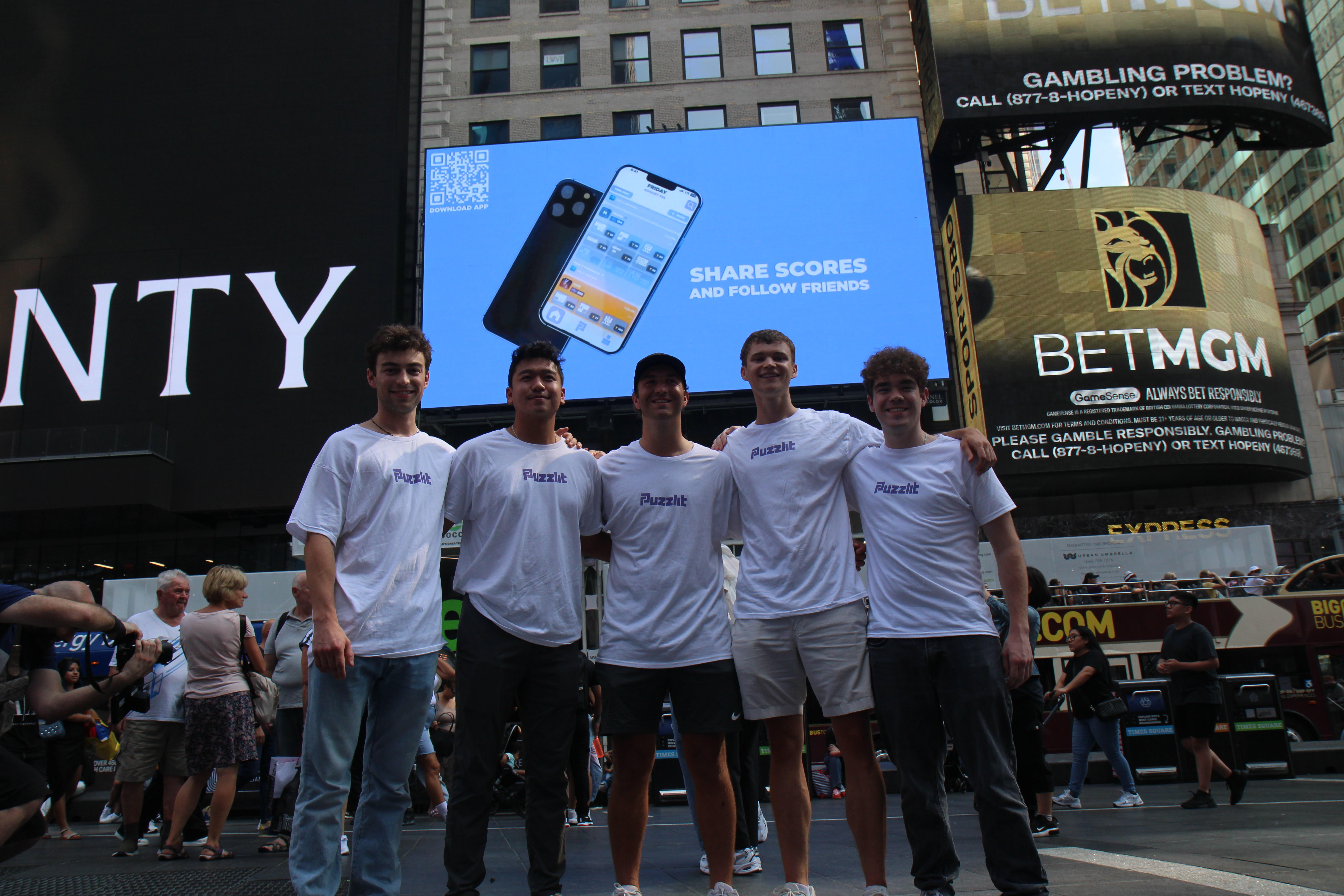 Furthest right Patrick Curley BS 24 and Second furthest right Chris Banas BS 24 with their team posing for a picture.jpg