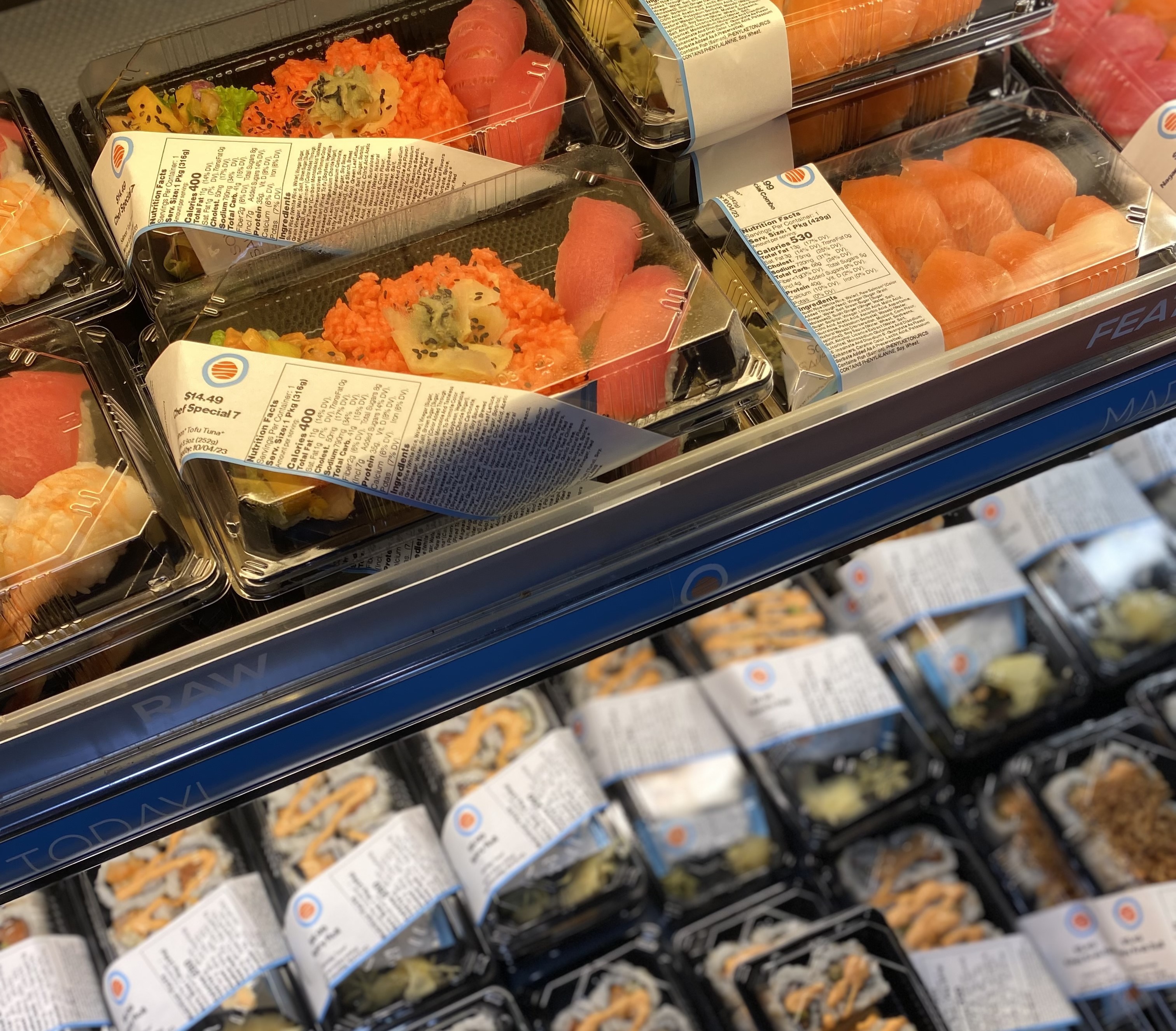 Colorful varieties of Hissho grab & go cases sushi lay out at the Café & Market at Crossroads.