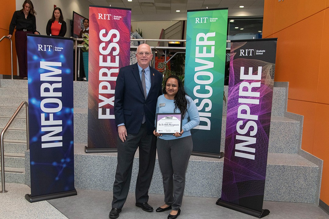 Event Winner stands next to President Munson