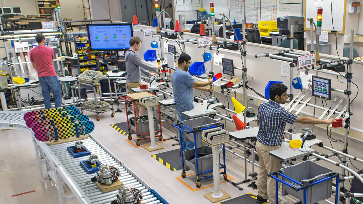 Students working in an industrial engineering lab.