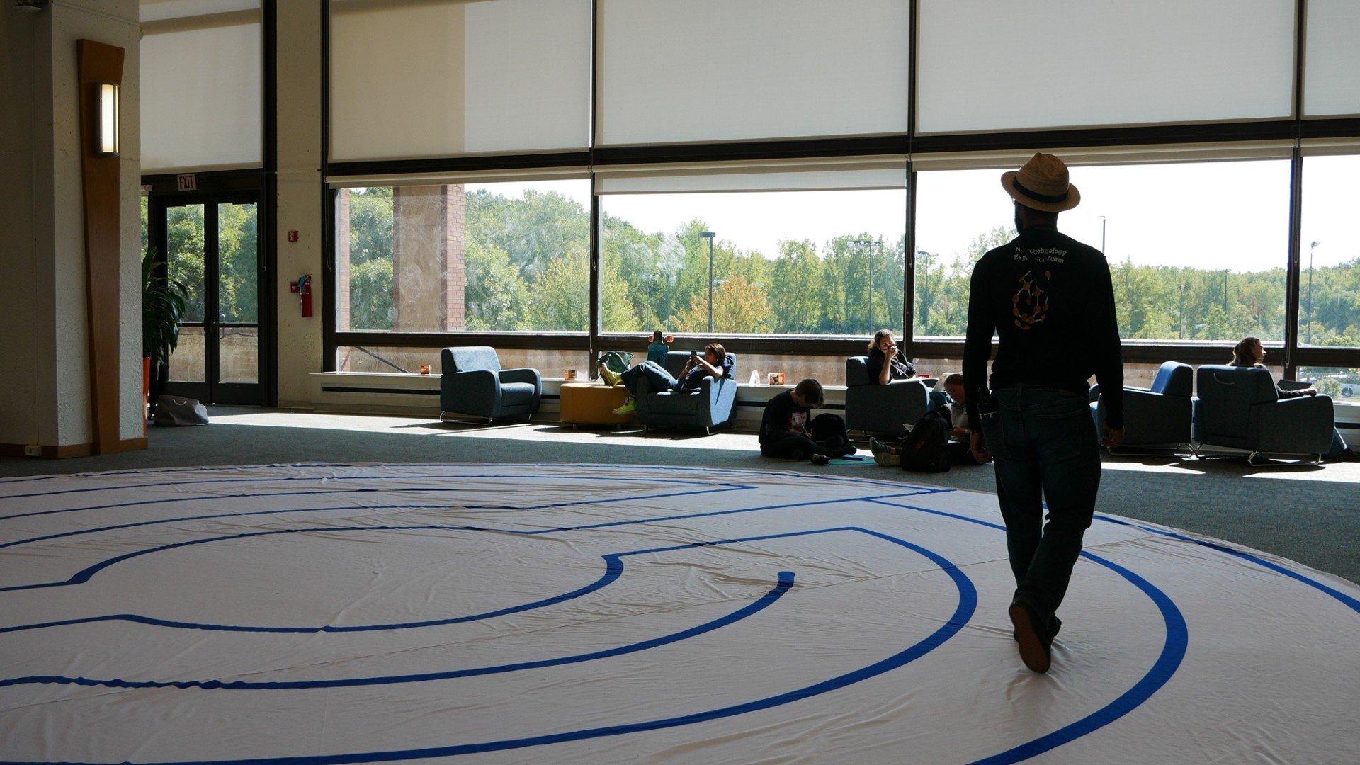 student walks the labyrinth slowly and intentionally in Fireside Lounge