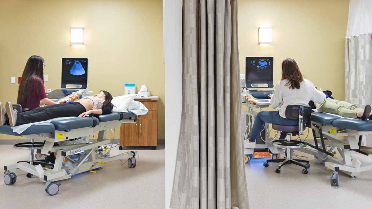 A medical lab with students doing ultrasounds on multiple patients.