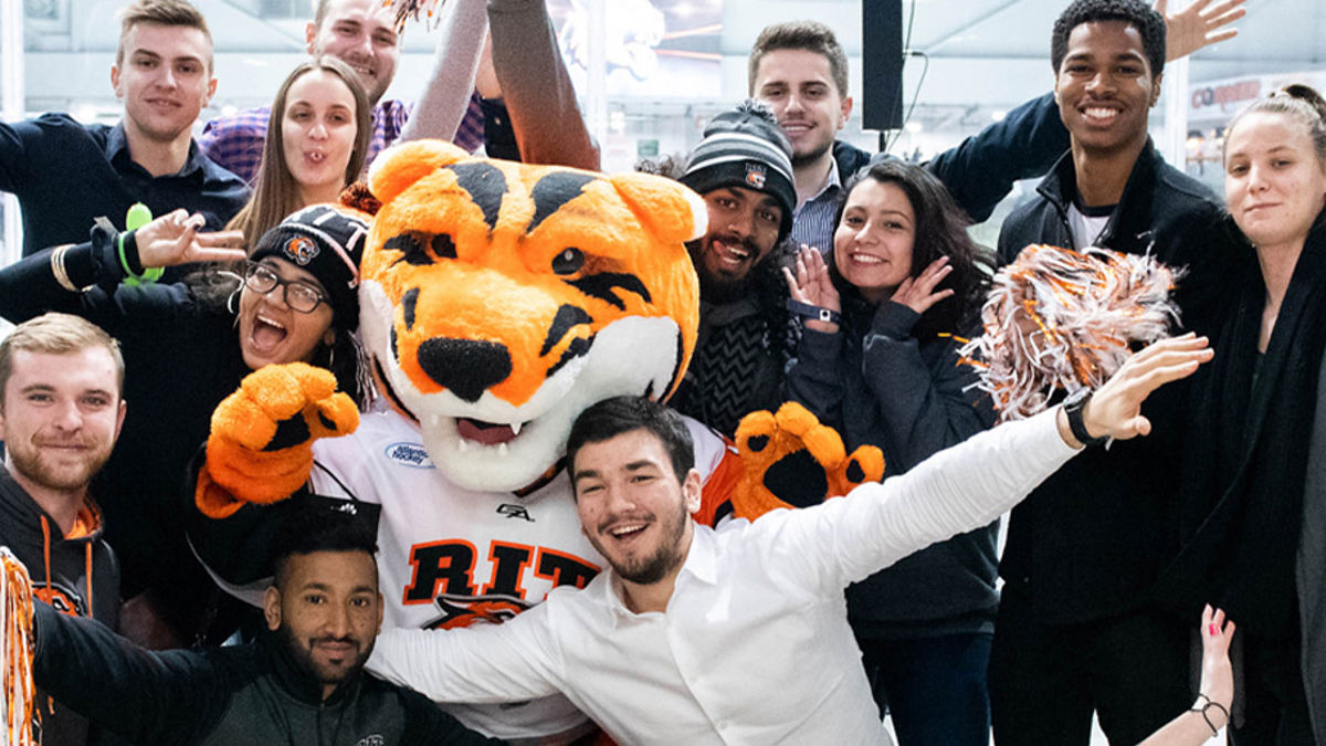 students posing with ritchie in front of ice at GPC