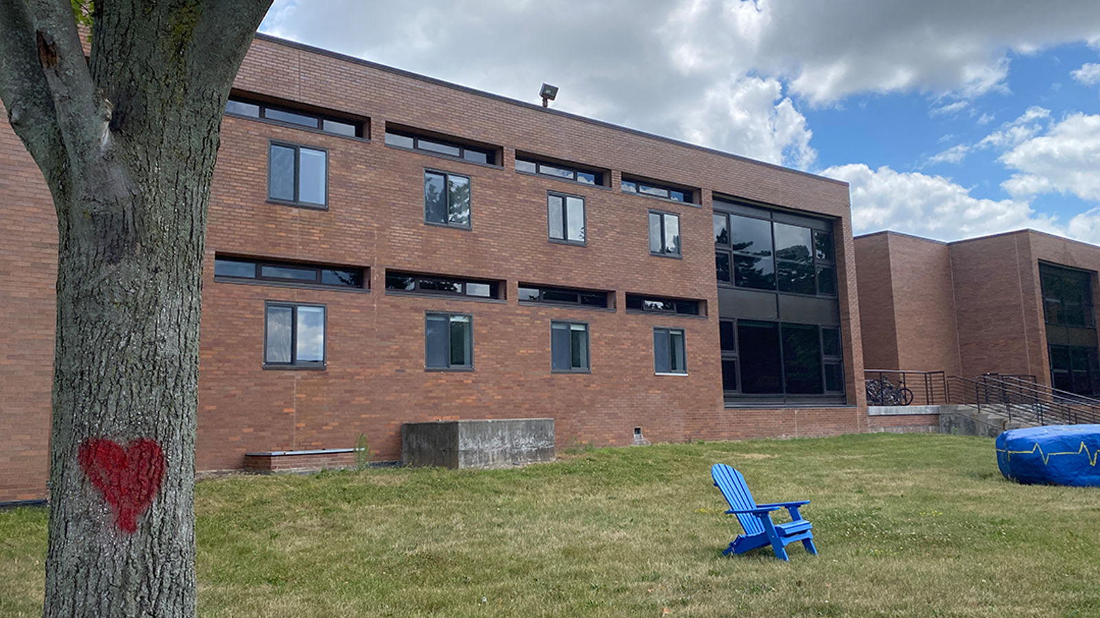 front of brick building, Residence Hall C