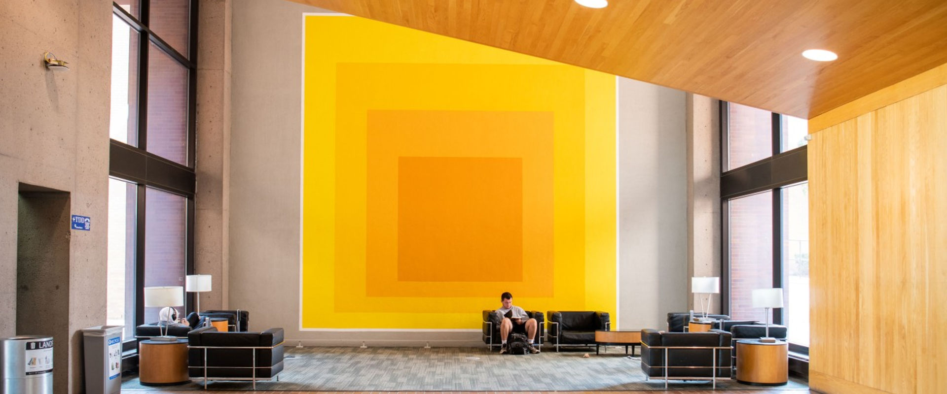 lobby of Eastman Hall featuring a graphic mural