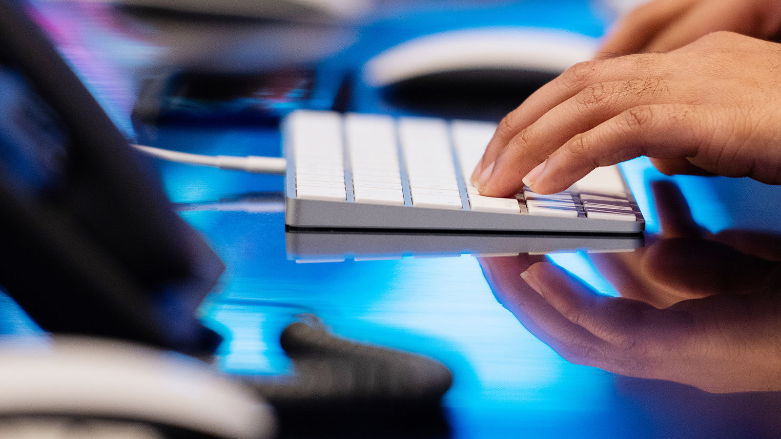 Person typing on a keyboard