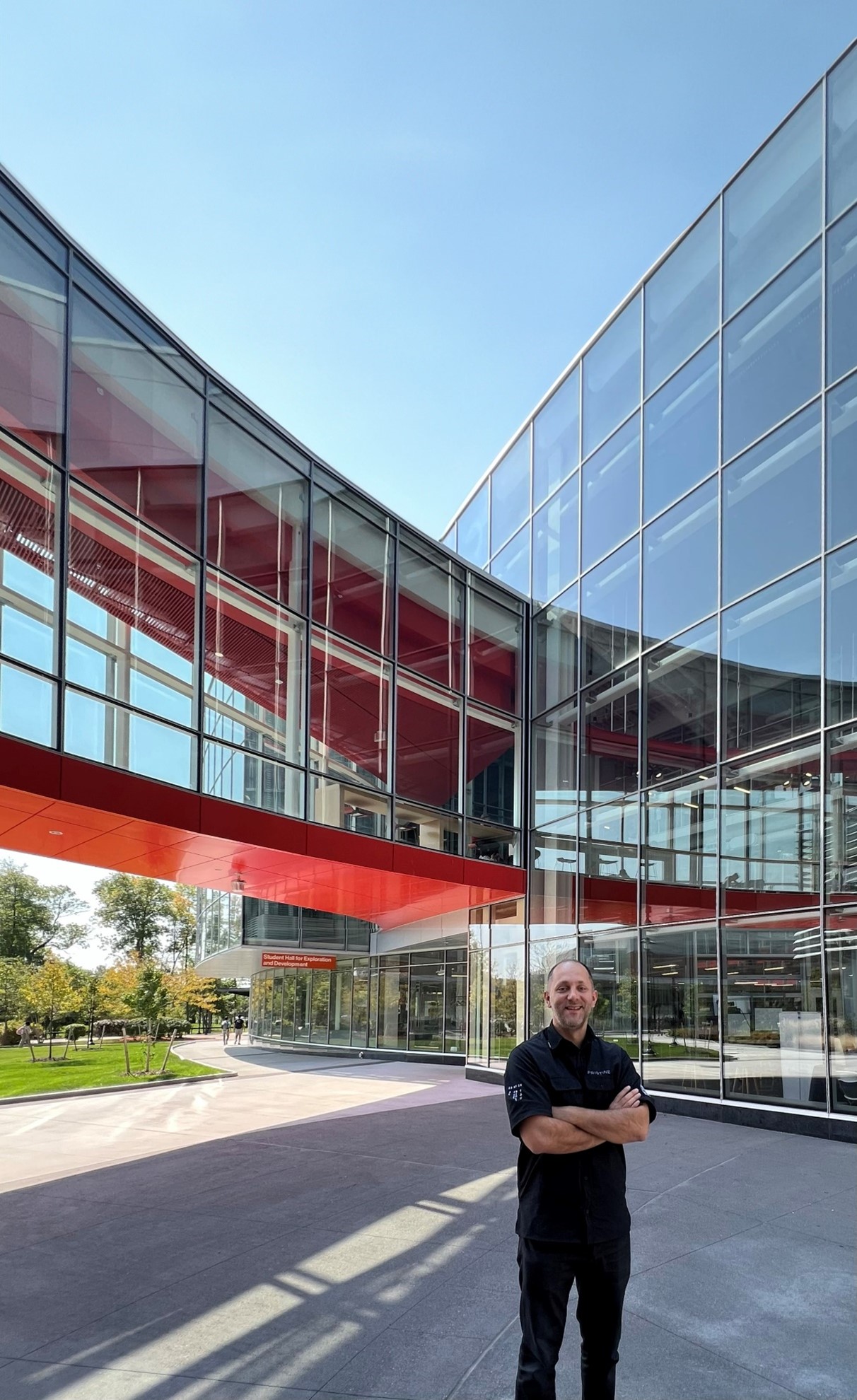 Agon Nimani at the front of the SHed building at RIT Main