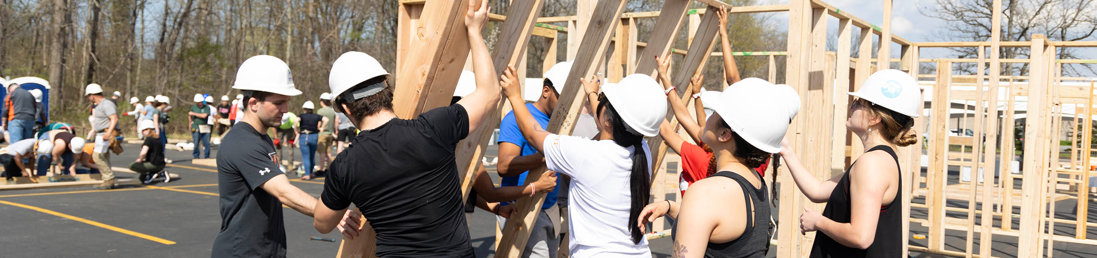 Students assemble a house frame during Framing Frenzy