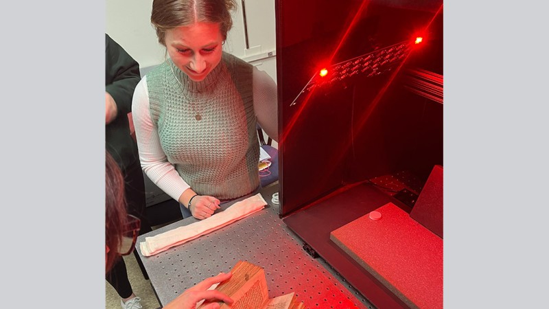 Kyra Schultz looking at multispectral imaging system.