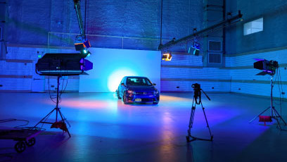 Sound stage with a blue light and a car