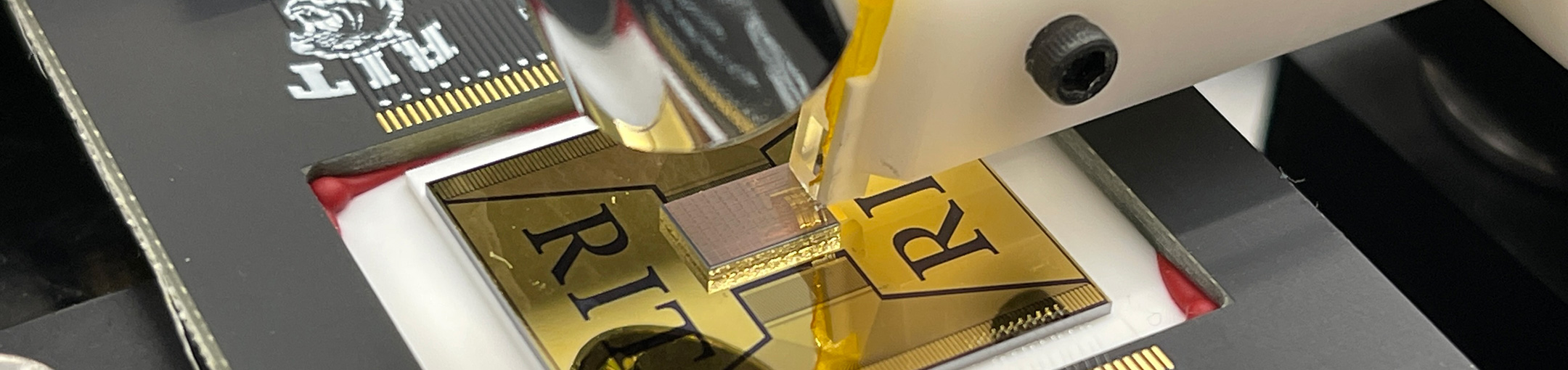 A CPU being engraved with the RIT logo.