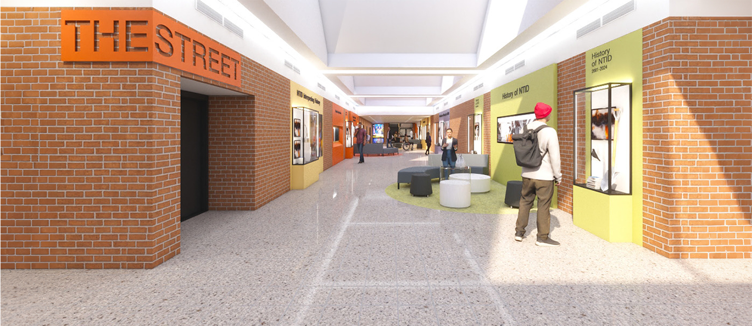 Rendering of NTID "street" hallway with student looking at photo