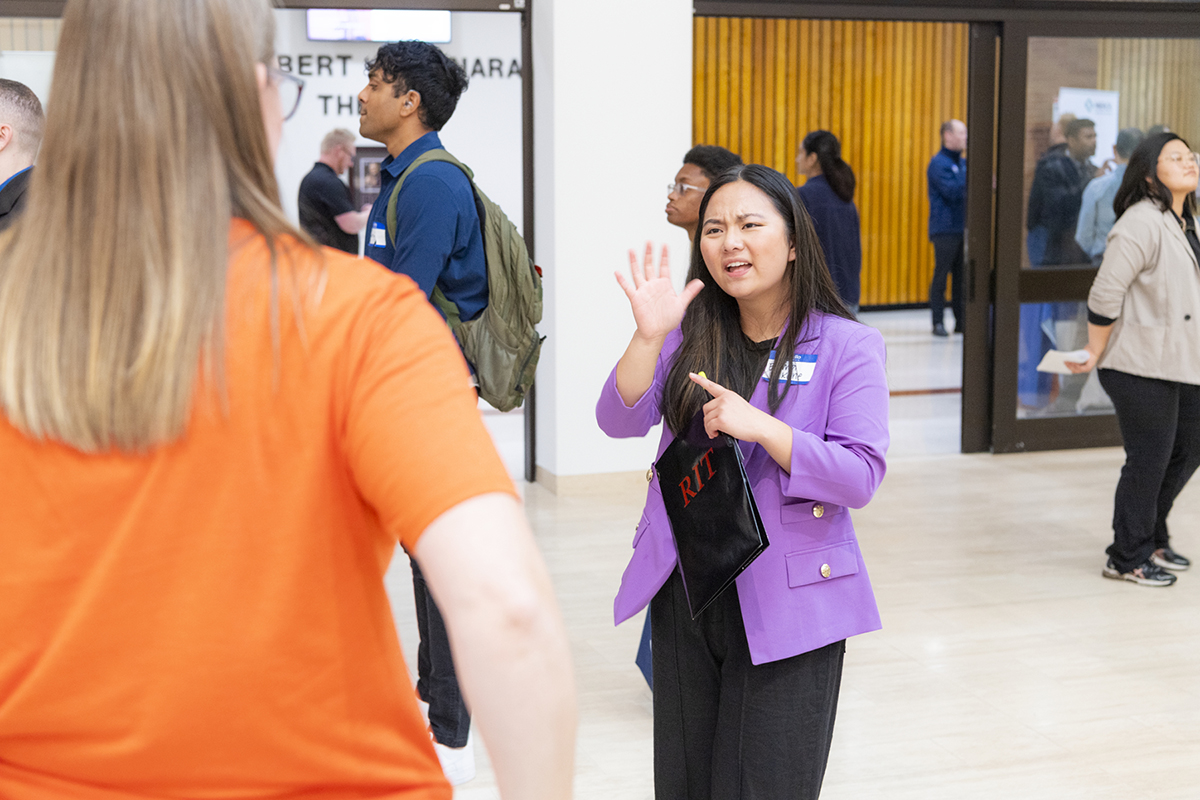 Students meet and converse with employers at the career fair