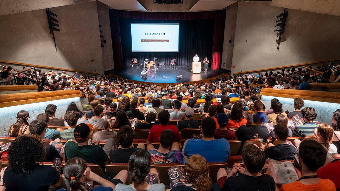 Perorming Arts Scholars sit in crowded Ingle Auditorium and learn about what is in store for them this year.