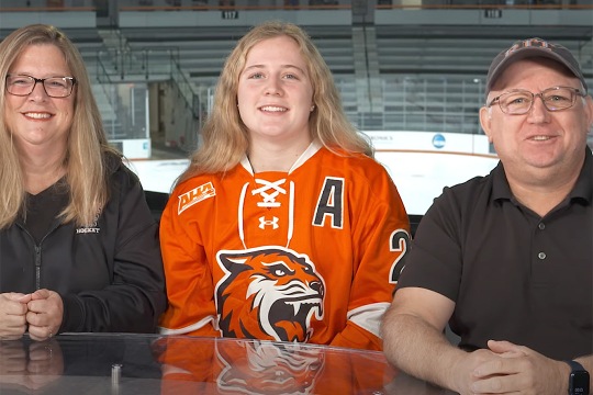 Emma Pickering, seated between her parents