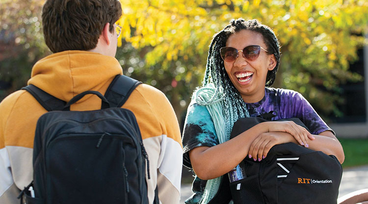 A group of students wearing masks using a cordless drill.