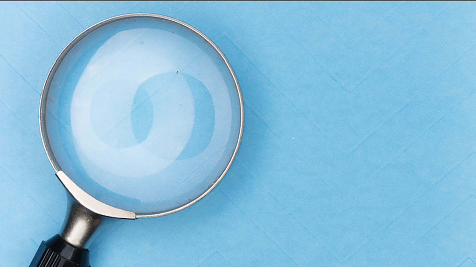 Magnifying Glass Against Blue Background